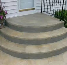 Custom, circular, beveled, concrete steps leading up to the back door of a house in Lehigh Valley.